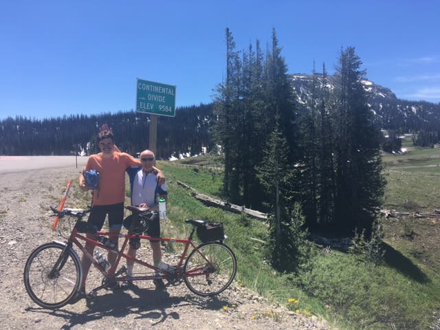 Chris and Ali at the continental divide sign